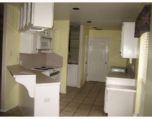 5210 Lethaby Drive Corpus Christi, TX 78413 - Photo 3 of 5 a kitchen with stainless steel appliances granite countertop a refrigerator and a stove