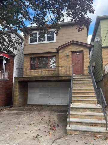 a front view of a house with a garage
