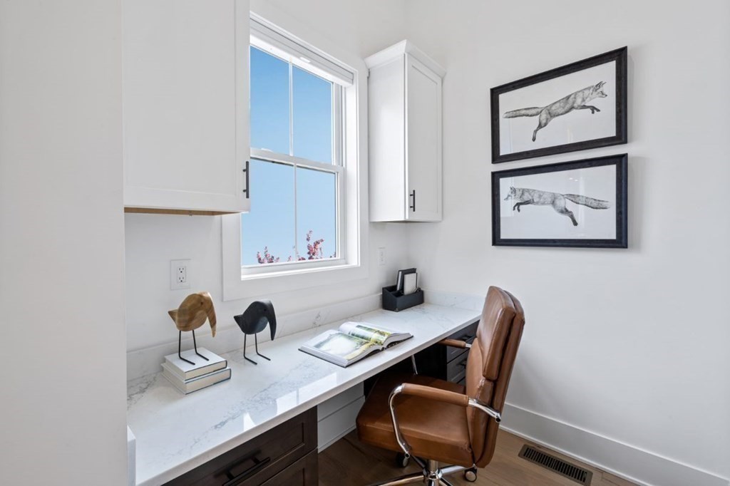 27 Barnes Boulevard, Unit 13 Hudson, MA 01749 - Photo 5 of 12 a view of a workspace with furniture