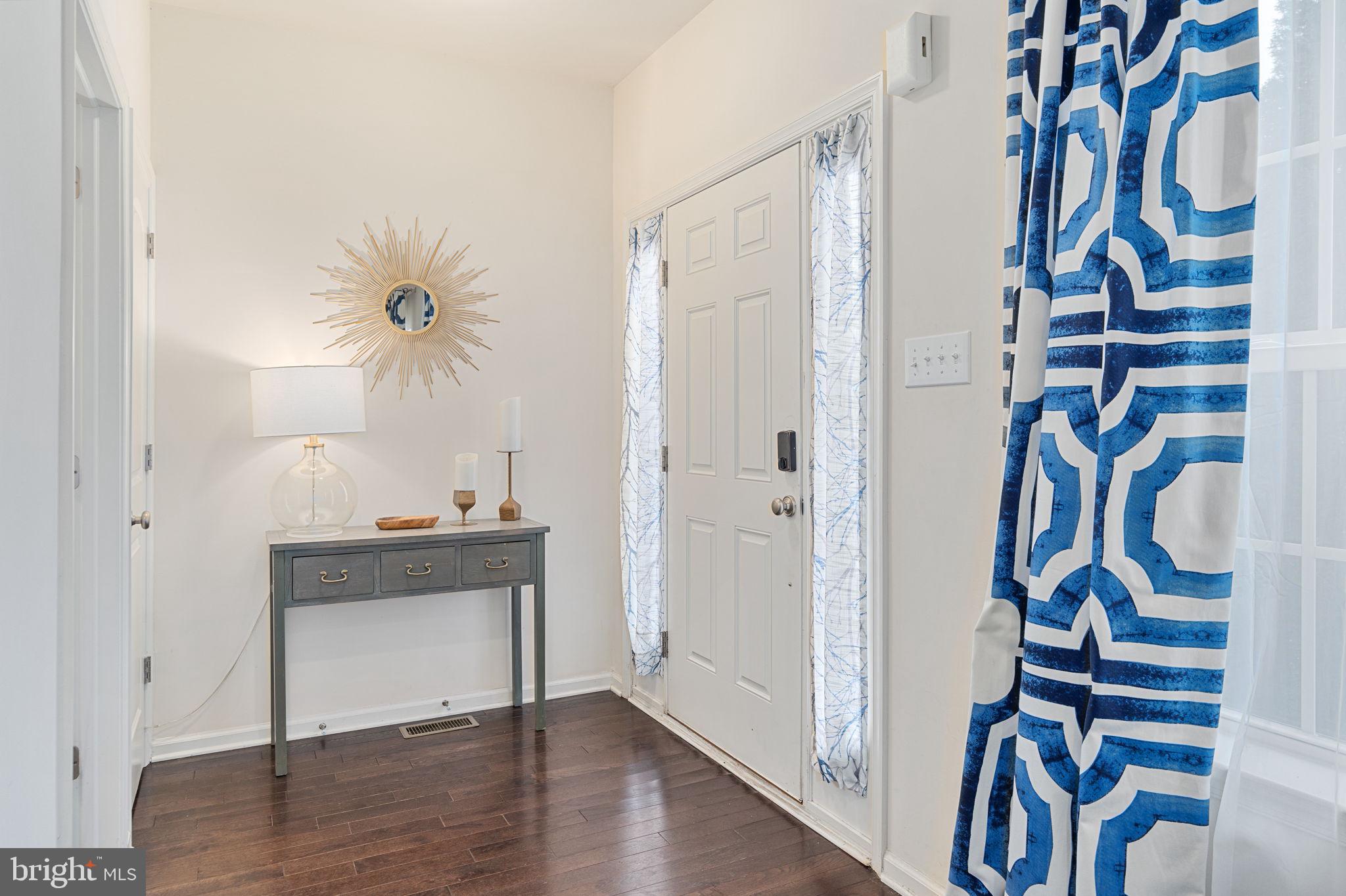 Foyer area with powder room and deep closet