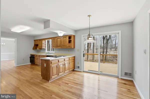 a kitchen that has a sink and a stove in it