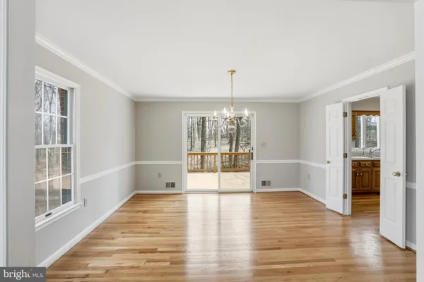 a view of an empty room with a fireplace