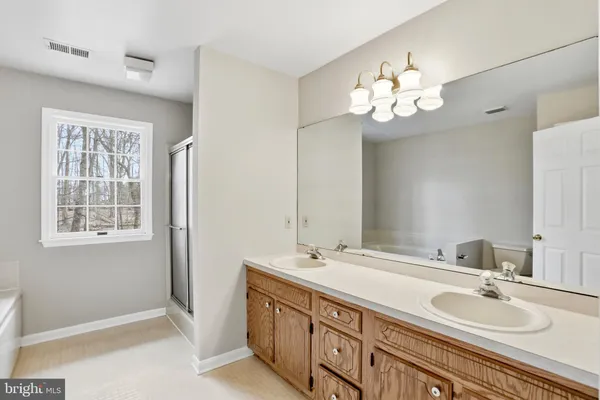 a white bath tub sitting next to a window
