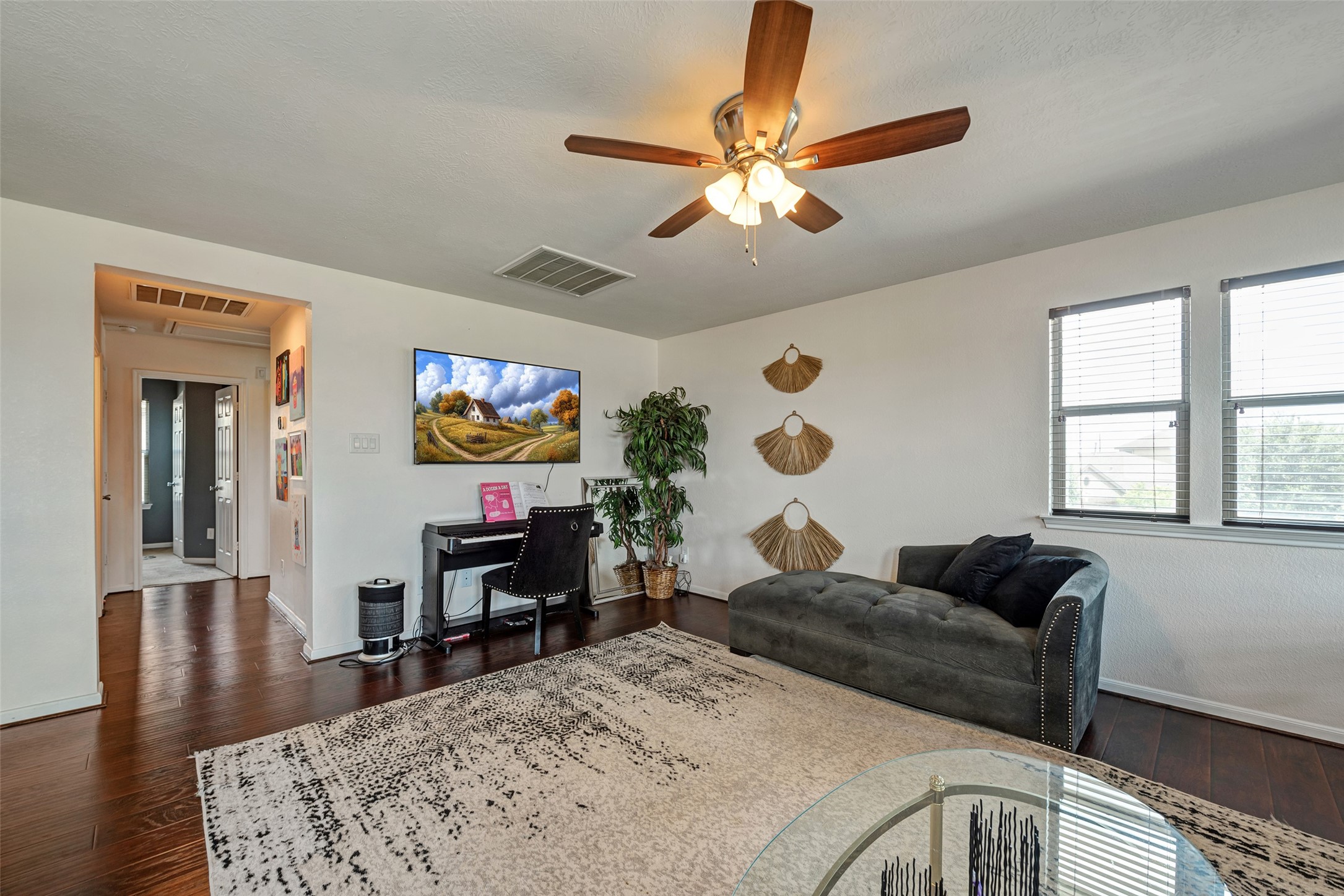 3554 Bennett Trails Drive Spring, TX 77386 - Photo 27 of 44 a living room with furniture and a flat screen tv with wooden floor