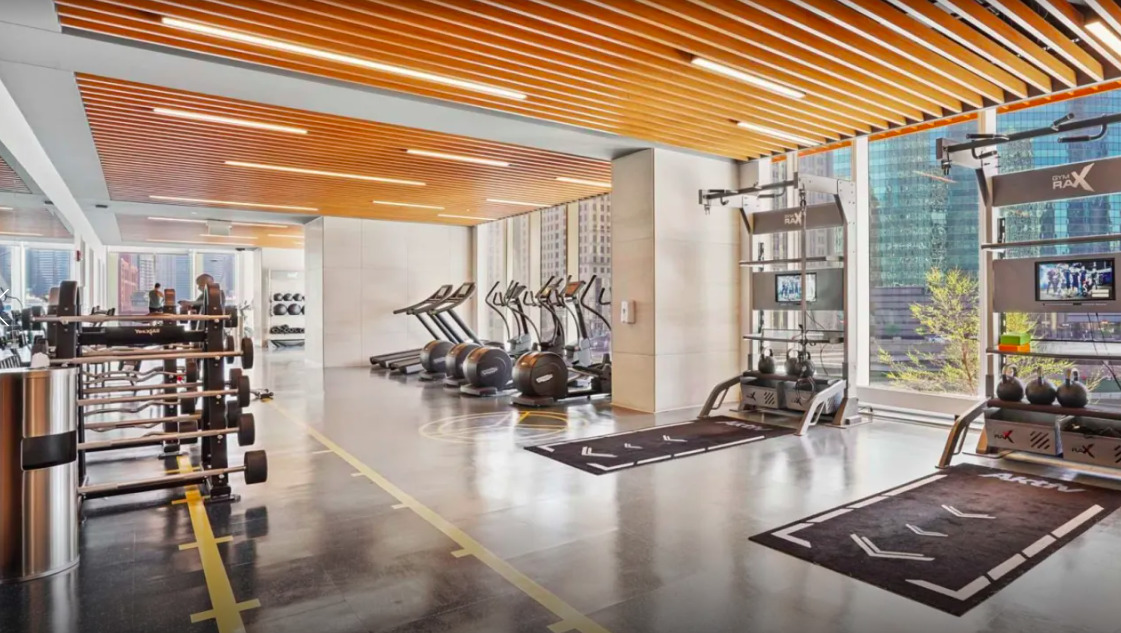 313 West Wolf Point Plaza, Unit 1910 Chicago, IL 60654 - Photo 22 of 30 a view of a room with gym equipment