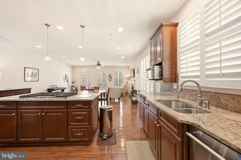 a kitchen with lots of counter top space and sink
