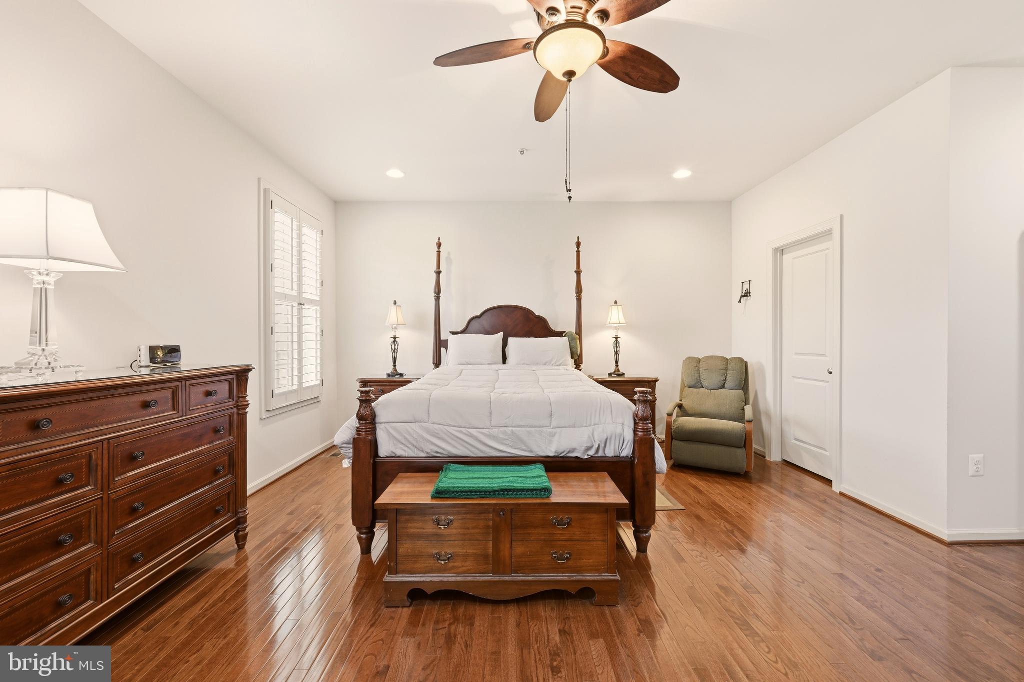 1104 Sweetbay Place Silver Spring, MD 20906 - Photo 19 of 43 a bedroom with a bed and wooden floor