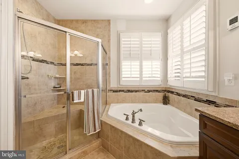 a bath tub sitting next to a window