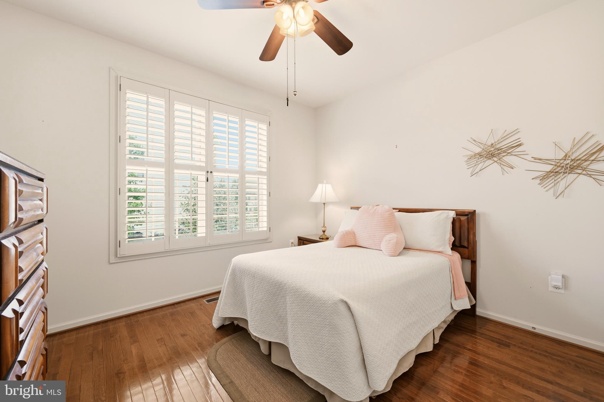 1104 Sweetbay Place Silver Spring, MD 20906 - Photo 23 of 43 a bedroom with a bed and a window