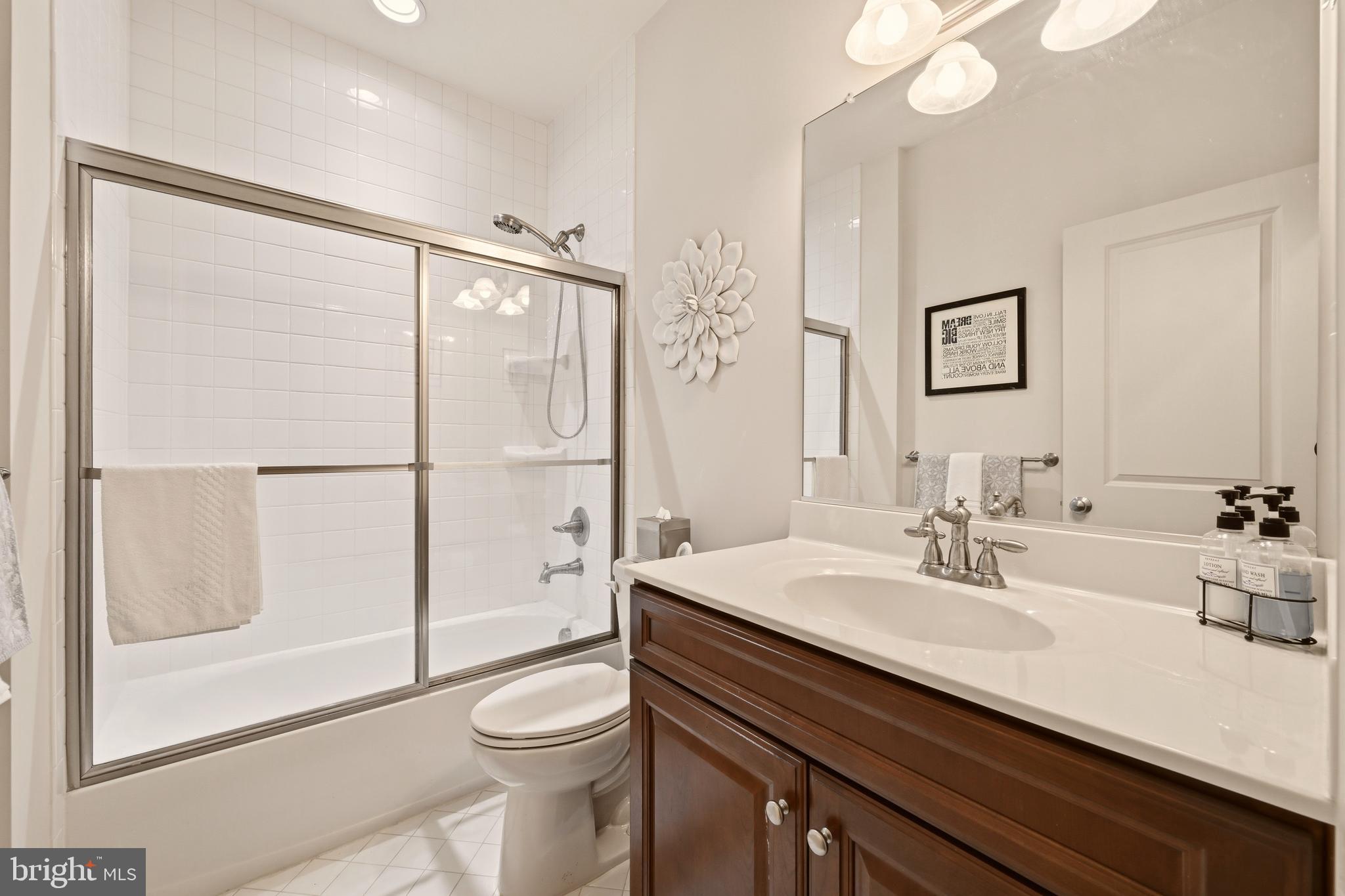 1104 Sweetbay Place Silver Spring, MD 20906 - Photo 28 of 43 a bathroom with a sink a toilet and shower