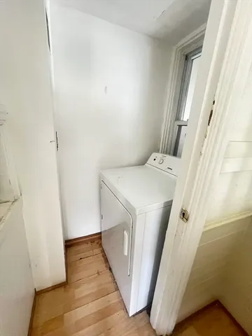 a utility room with a window dryer and washer