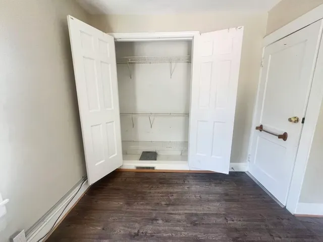 a view of entryway with wooden floor