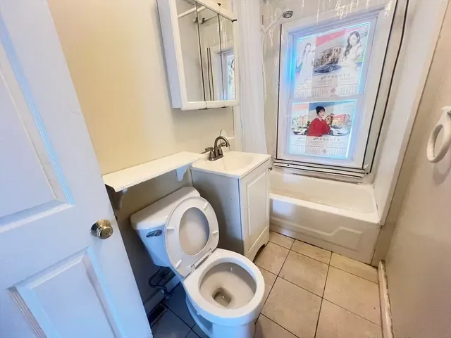 a bathroom with a toilet and a sink