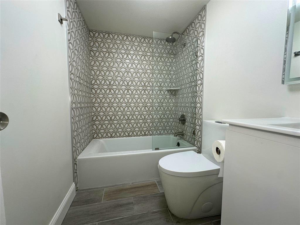 50 Southwest 3rd Avenue, Unit 110 Boca Raton, FL 33432 - Photo 12 of 21 a bathroom with a bathtub and a shower