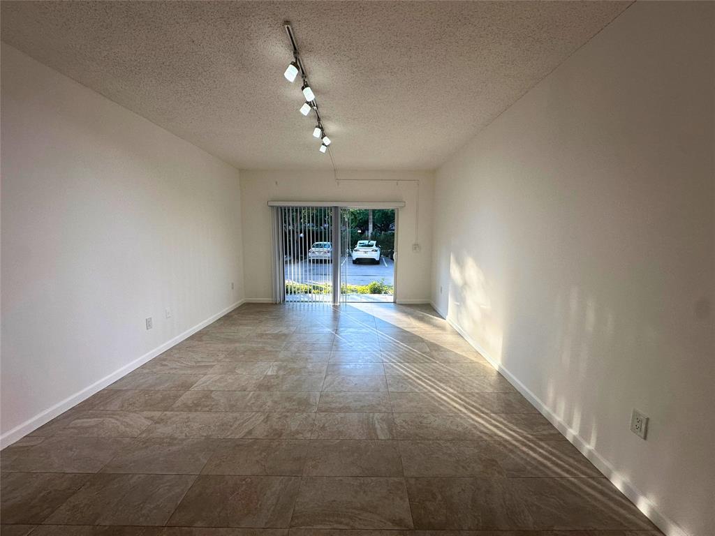 50 Southwest 3rd Avenue, Unit 110 Boca Raton, FL 33432 - Photo 18 of 21 wooden floor in an empty room with a window