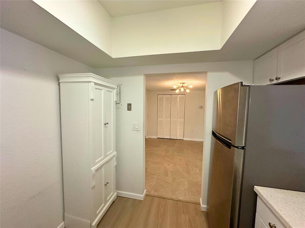 50 Southwest 3rd Avenue, Unit 110 Boca Raton, FL 33432 - Photo 7 of 21 a view of a refrigerator in kitchen and a sink