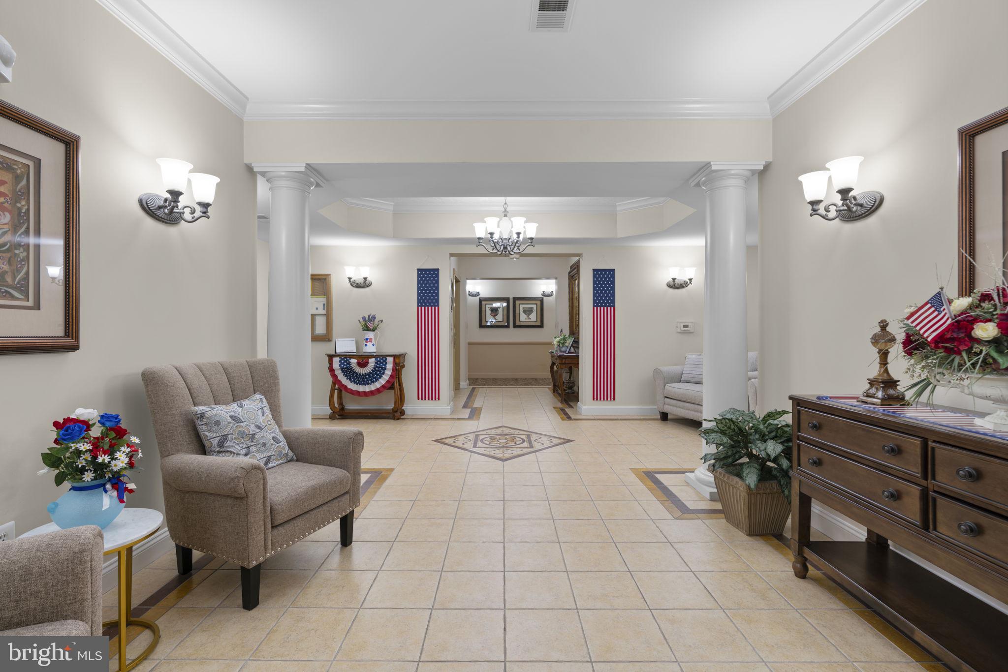 7315 Maplecrest Road, Unit 104 Elkridge, MD 21075 - Photo 5 of 58 a living room with furniture and flowers