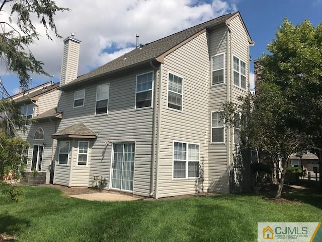154 Nebula Road, Unit 154 Piscataway, NJ 08854 - Photo 2 of 2 a front view of a house with a garden