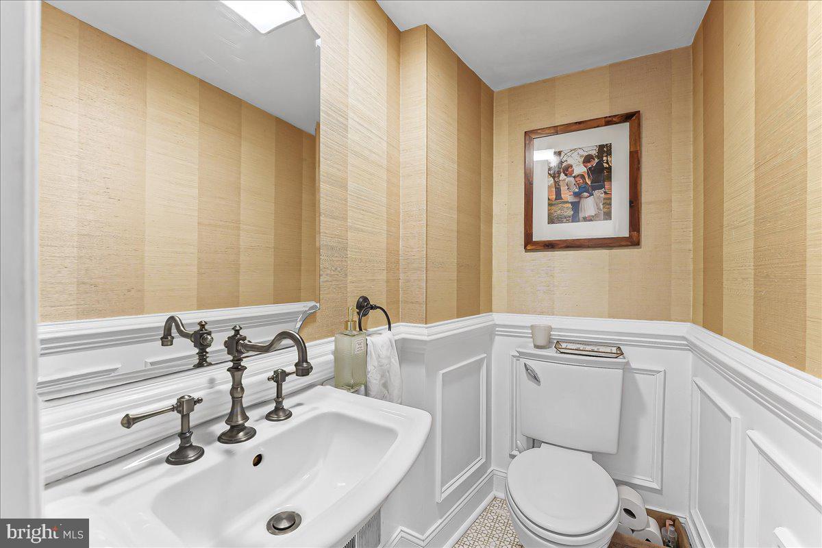 204 Country Gate Road Wayne, PA 19087 - Photo 17 of 34 a bathroom with a sink a toilet and mirror