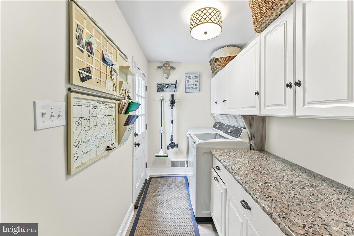 204 Country Gate Road Wayne, PA 19087 - Photo 18 of 34 a kitchen with cabinets and wooden floor