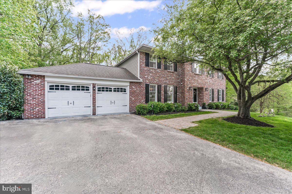 204 Country Gate Road Wayne, PA 19087 - Photo 2 of 34 a view of house with yard and a trees in front of it