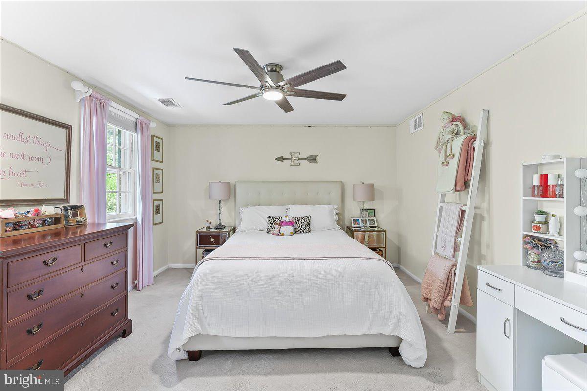 204 Country Gate Road Wayne, PA 19087 - Photo 23 of 34 a bedroom with a bed and a cabinets