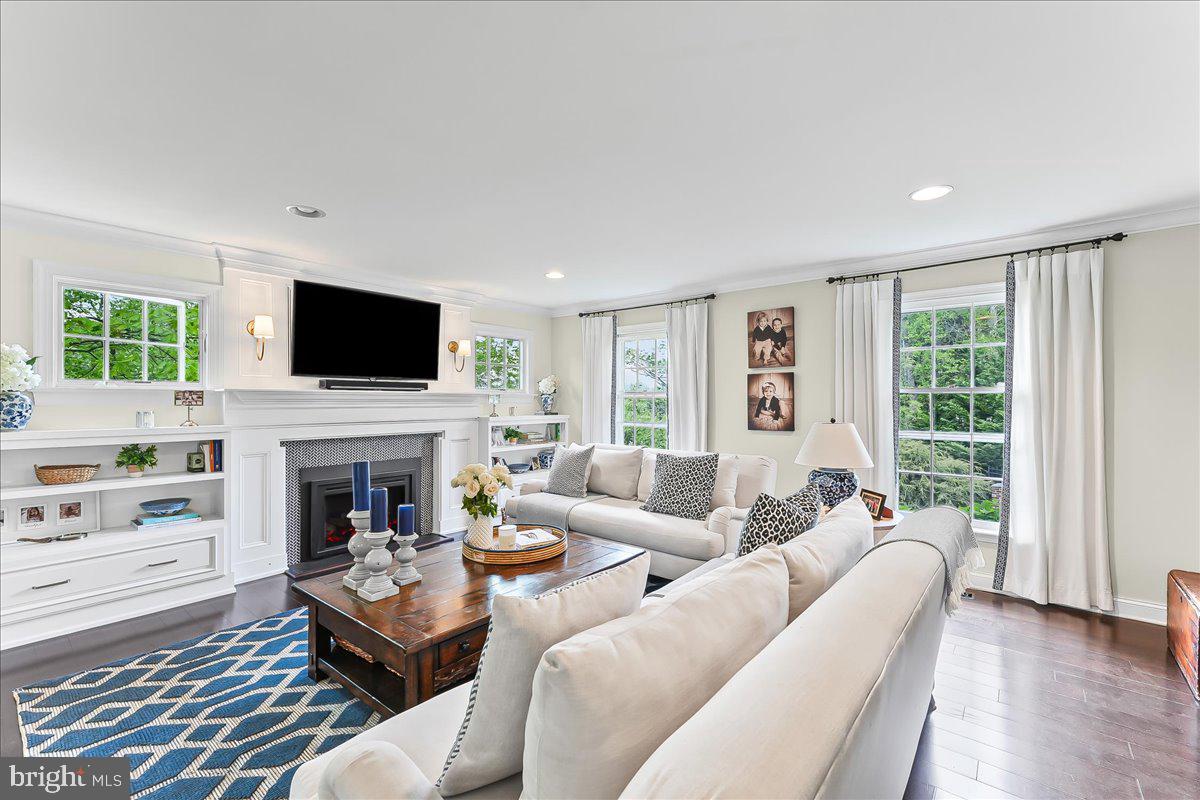 204 Country Gate Road Wayne, PA 19087 - Photo 8 of 34 a living room with furniture a fireplace and a flat screen tv