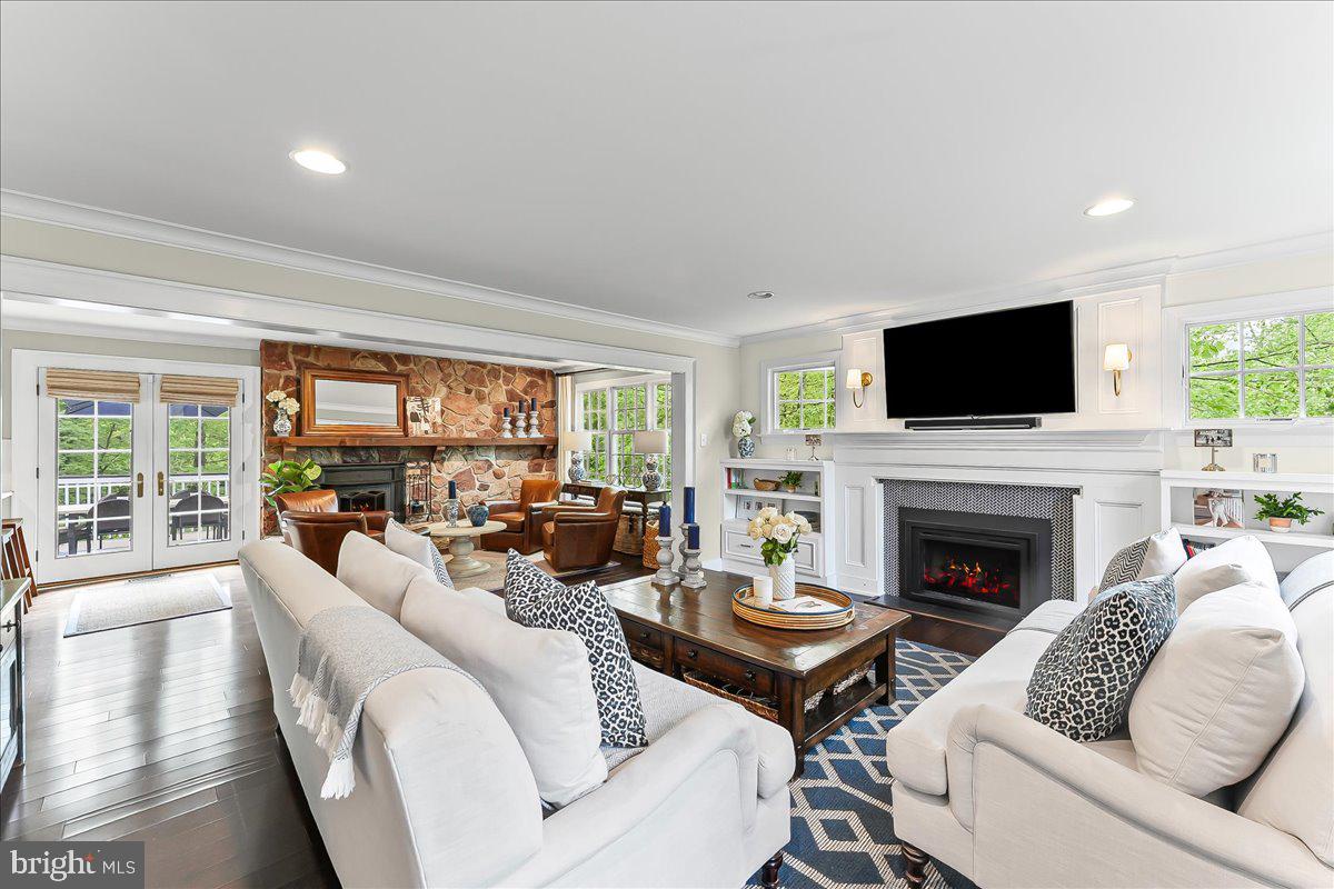 204 Country Gate Road Wayne, PA 19087 - Photo 9 of 34 a living room with furniture a fireplace and a flat screen tv