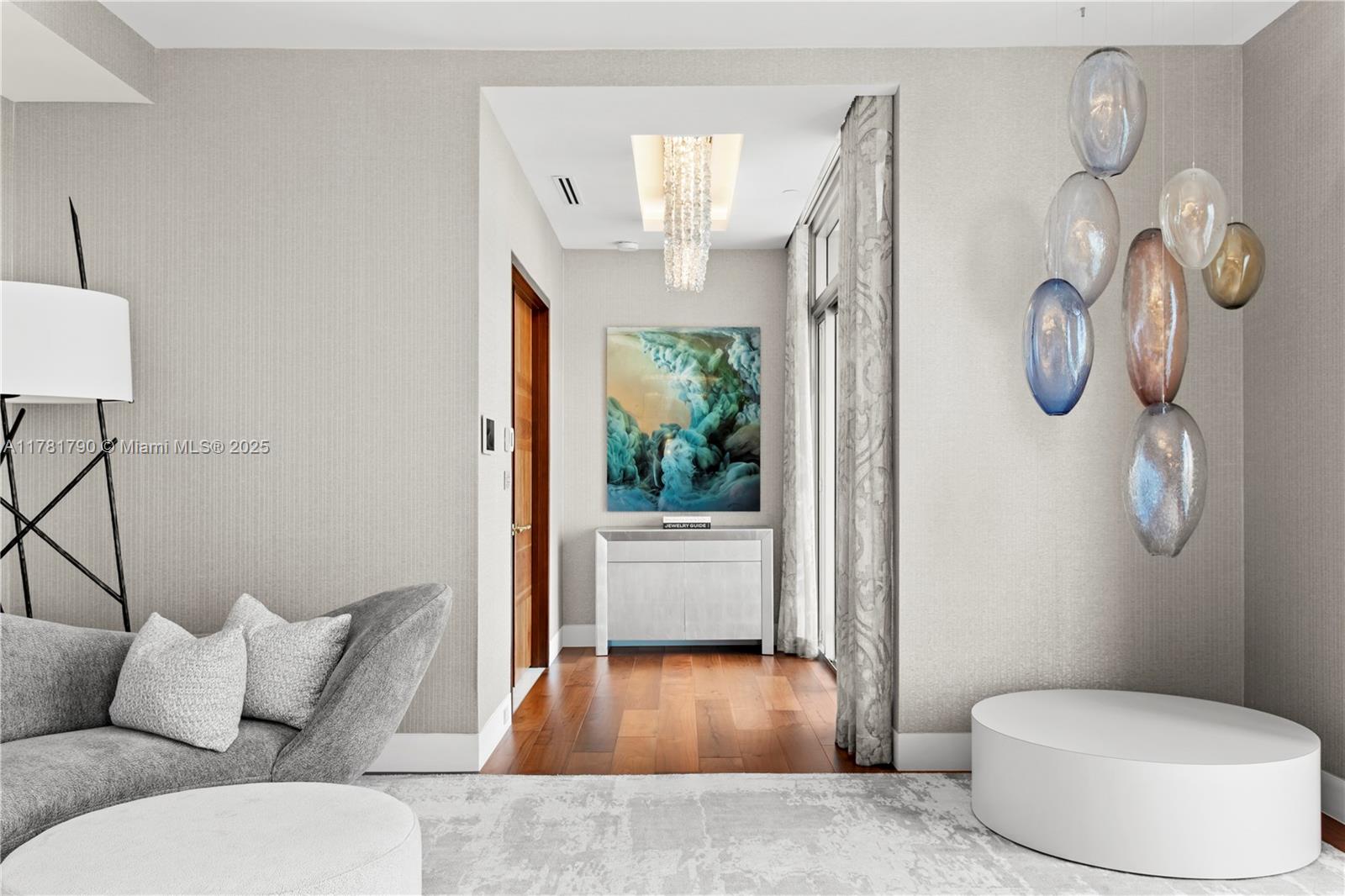 1425 Brickell Avenue, Unit PH4BCD Miami, FL 33131 - Photo 13 of 28 a living room with furniture and a window