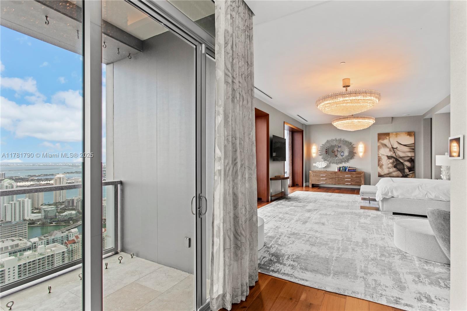 1425 Brickell Avenue, Unit PH4BCD Miami, FL 33131 - Photo 14 of 28 a view of living room kitchen with furniture and large window