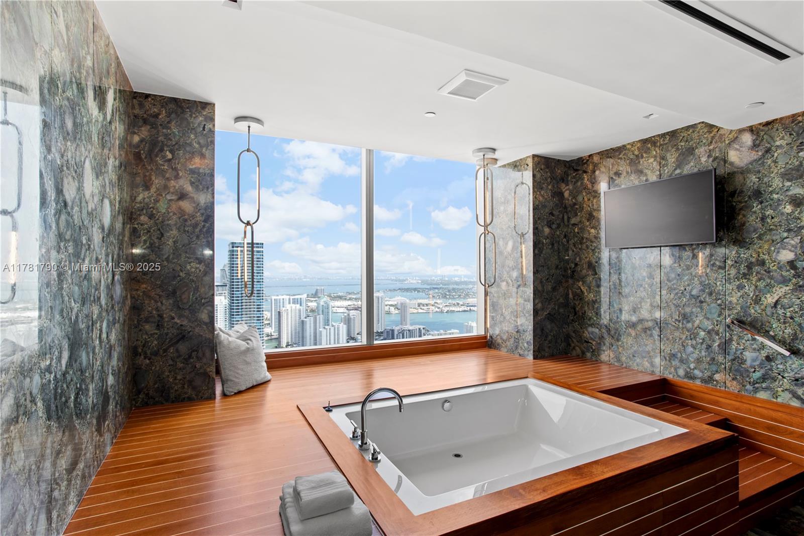 1425 Brickell Avenue, Unit PH4BCD Miami, FL 33131 - Photo 21 of 28 a room with pool table and windows