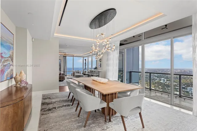 a view of a dining room with furniture window and outside view