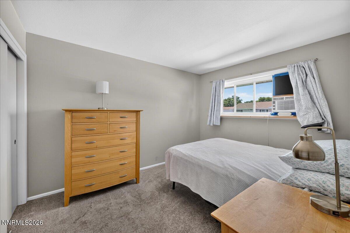 5 Smithridge Park Reno, NV 89502 - Photo 16 of 24 a bedroom with a bed and a dresser