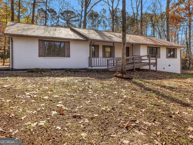 a house with trees in the background