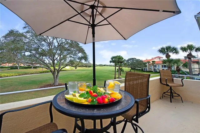 a outdoor space with furniture and umbrella