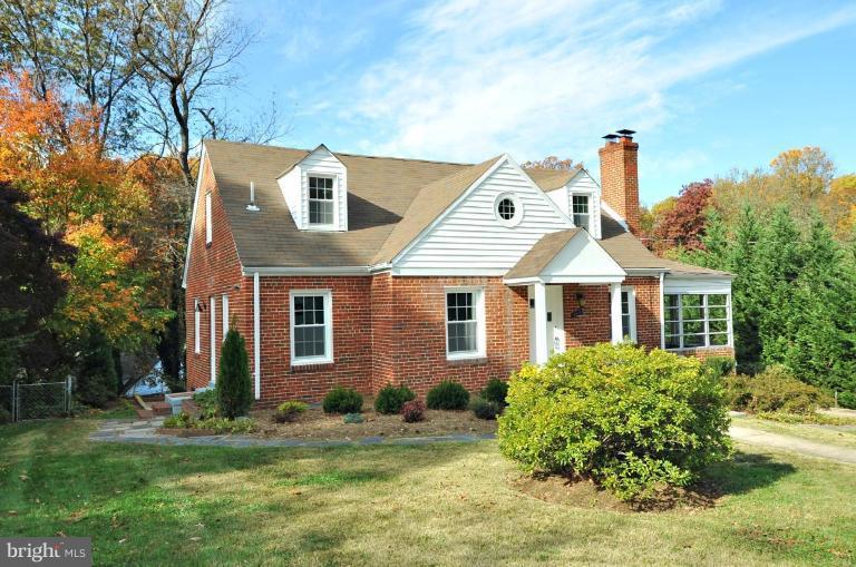 9518 St Andrews Way Silver Spring, MD 20901 - Photo 2 of 29 a front view of a house with a yard