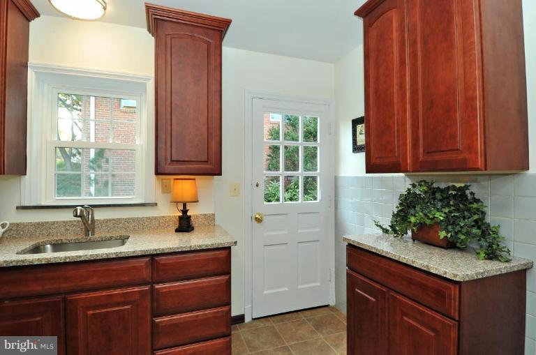 9518 St Andrews Way Silver Spring, MD 20901 - Photo 13 of 29 a kitchen with a sink and cabinets