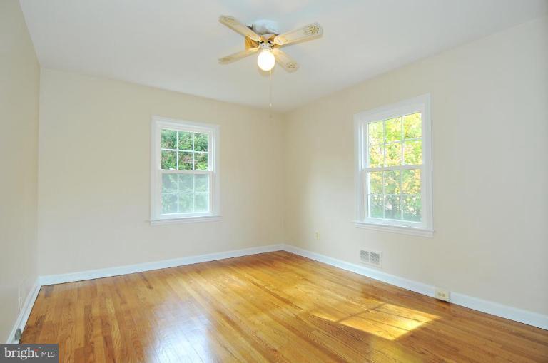9518 St Andrews Way Silver Spring, MD 20901 - Photo 15 of 29 a view of a room with a window and a ceiling fan