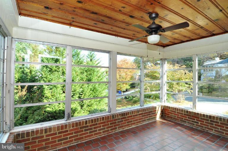 9518 St Andrews Way Silver Spring, MD 20901 - Photo 7 of 29 a view of a room with wooden floor and windows