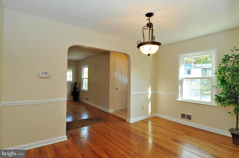 9518 St Andrews Way Silver Spring, MD 20901 - Photo 10 of 29 a view of empty room with wooden floor and fan