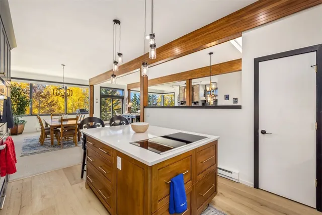 a open kitchen with stainless steel appliances granite countertop a stove and a refrigerator