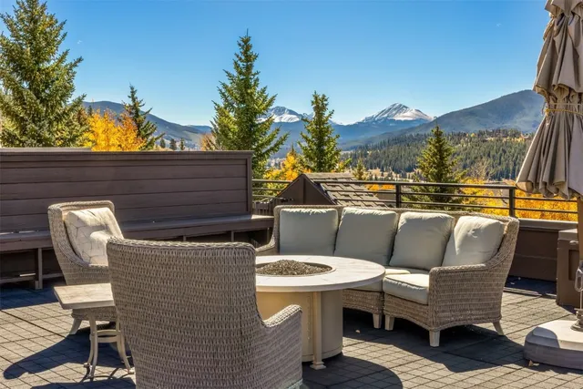 a view of a patio with table and chairs and potted plants