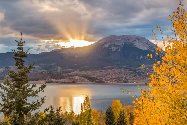a view of a house with pool and sitting area