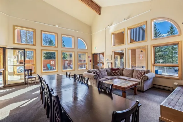 a view of a house with a yard patio and fire pit