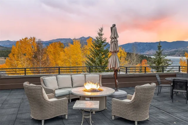 a balcony with table and chairs