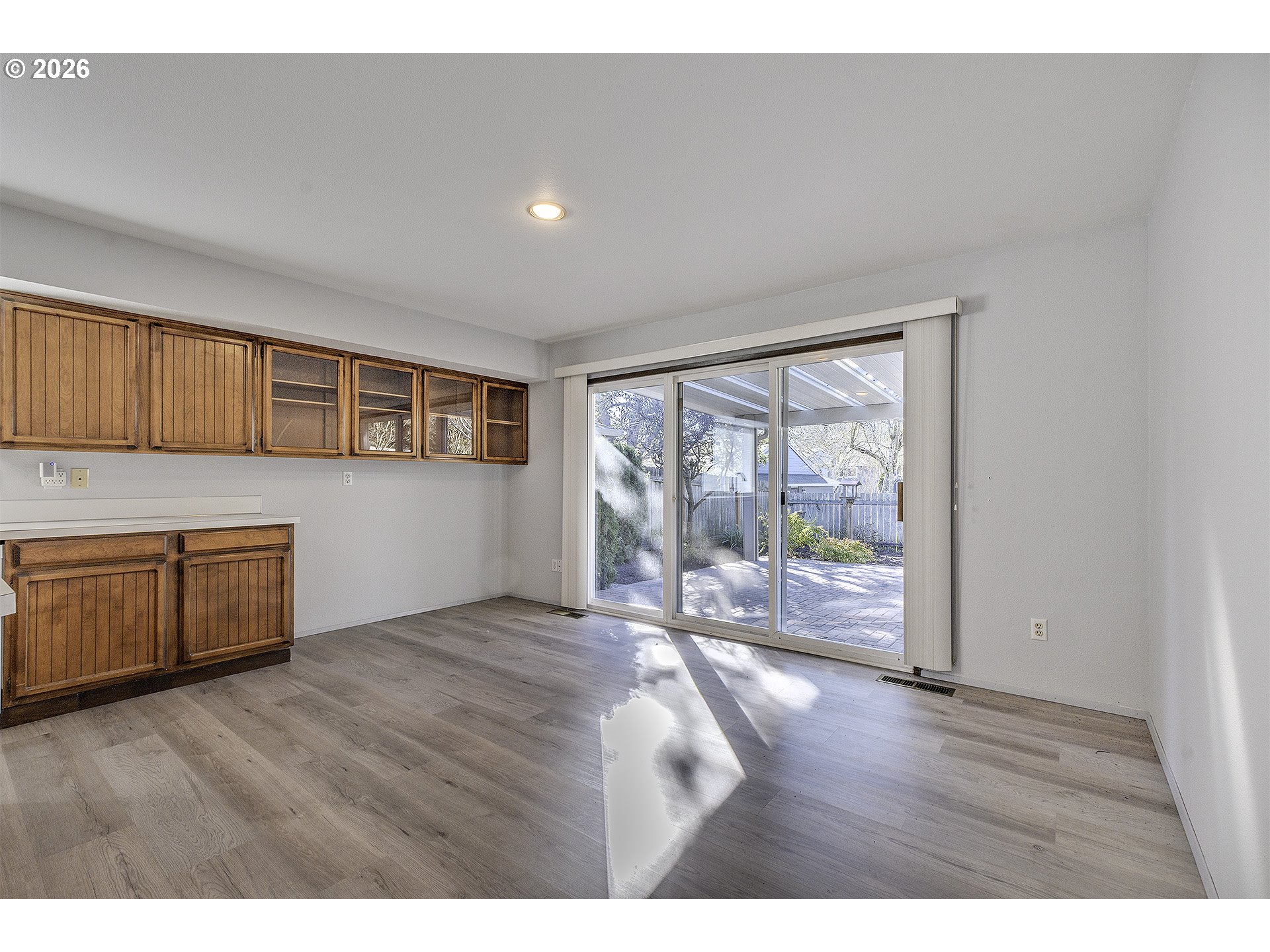 15765 Southwest Highland Court Portland, OR 97224 - Photo 11 of 30 a view of workspace with wooden floor and windows