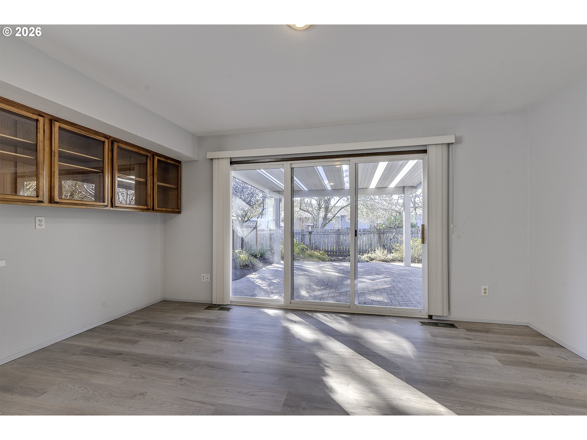 15765 Southwest Highland Court Portland, OR 97224 - Photo 13 of 30 a view of empty room with wooden floor and fan