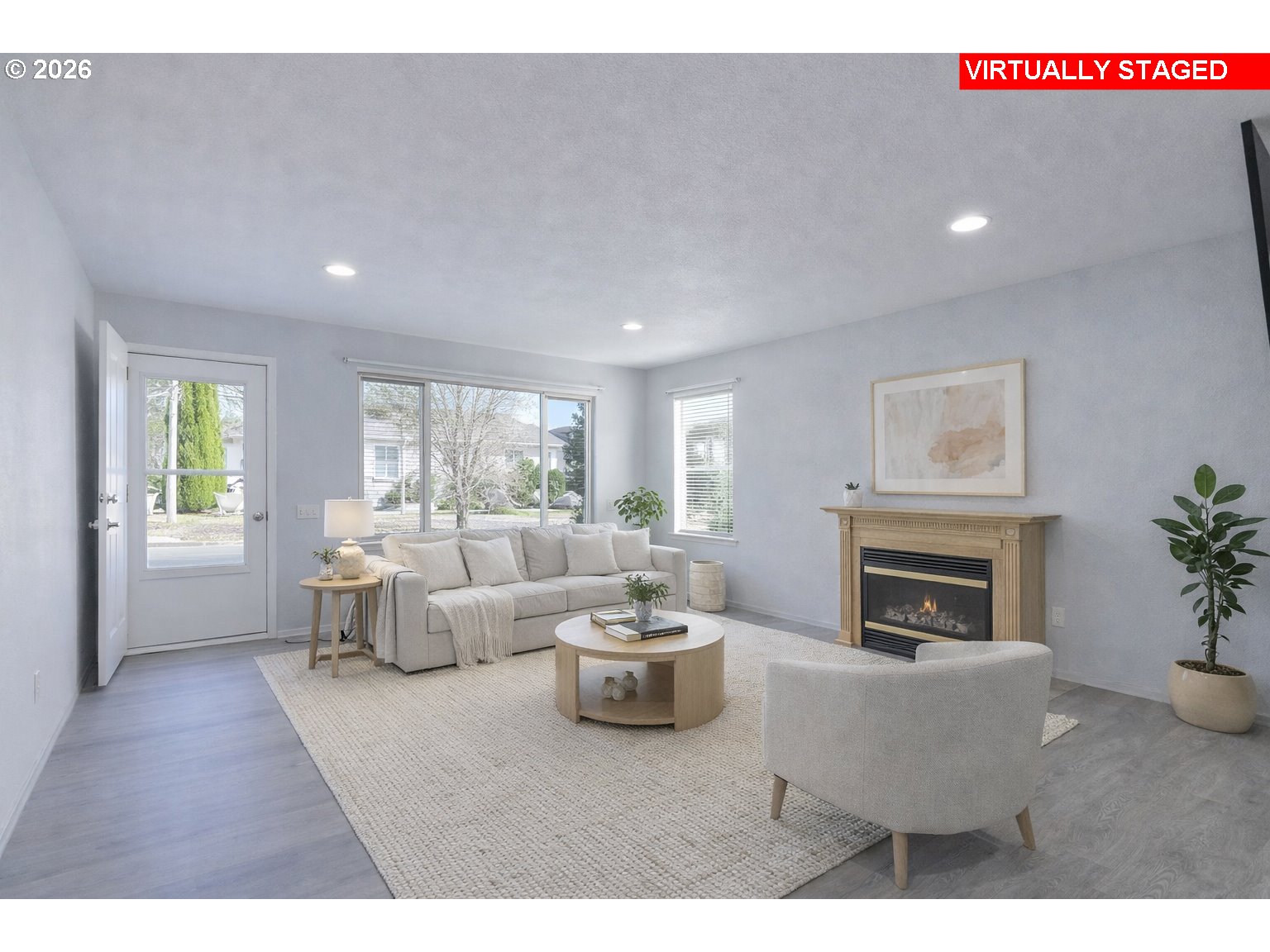 15765 Southwest Highland Court Portland, OR 97224 - Photo 2 of 30 a living room with furniture and a fireplace