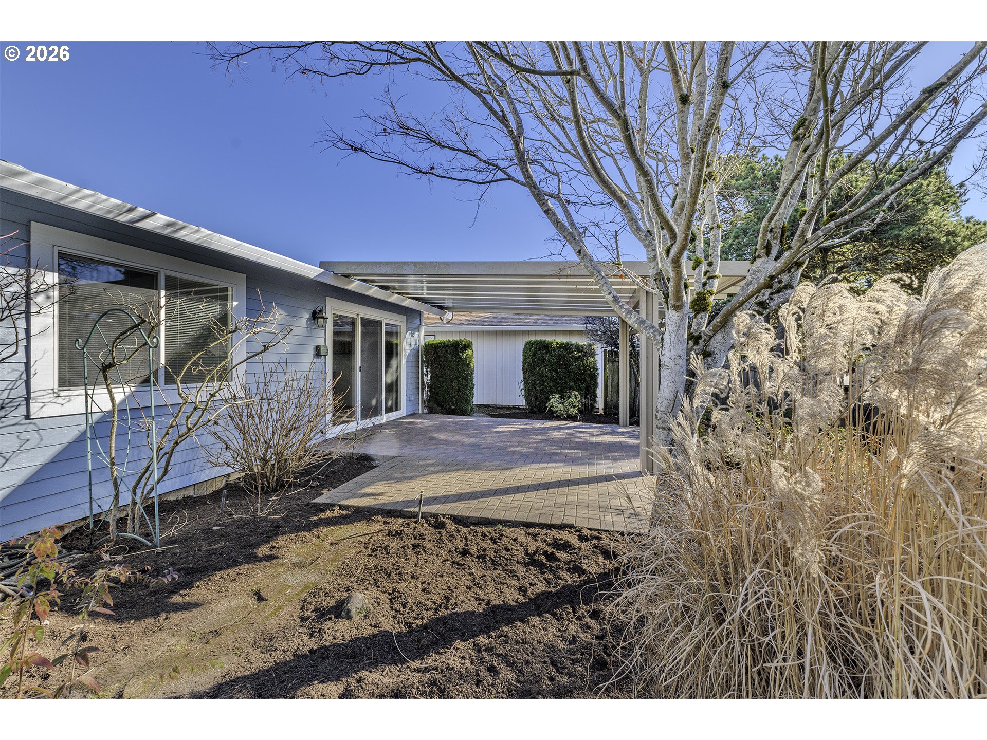 15765 Southwest Highland Court Portland, OR 97224 - Photo 24 of 30 a view of a house with backyard and sitting area