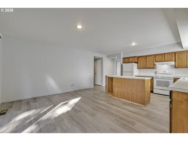 a view of kitchen with wooden floor